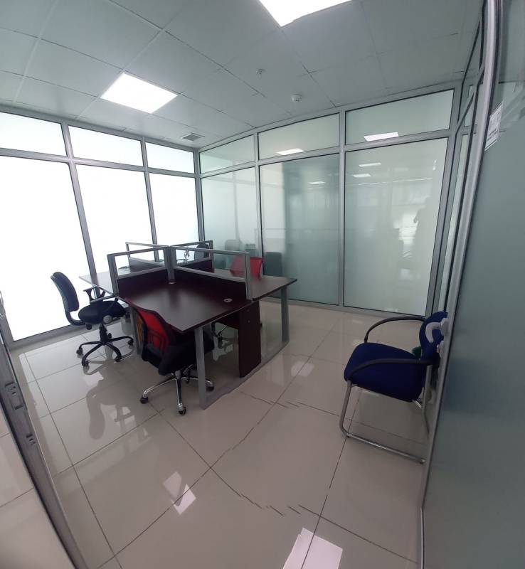 Modern small office space with glass walls, tiled floor inside PH BICSA Obarrio Panama