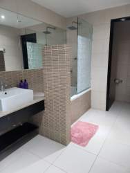 Modern furnished master bedroom with ocean view balcony PH Founders Playa Blanca