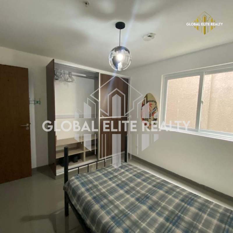 Second bedroom with wardrobe, window, air conditioner PH La Riviera Pedregal Panama