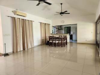 Open dining and living room with tile floors and ceiling fans Residencial San Carlitos