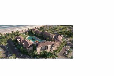 Contemporary beachfront apartment building with balconies glass railings ocean view at Playa Caracol Punta Chame