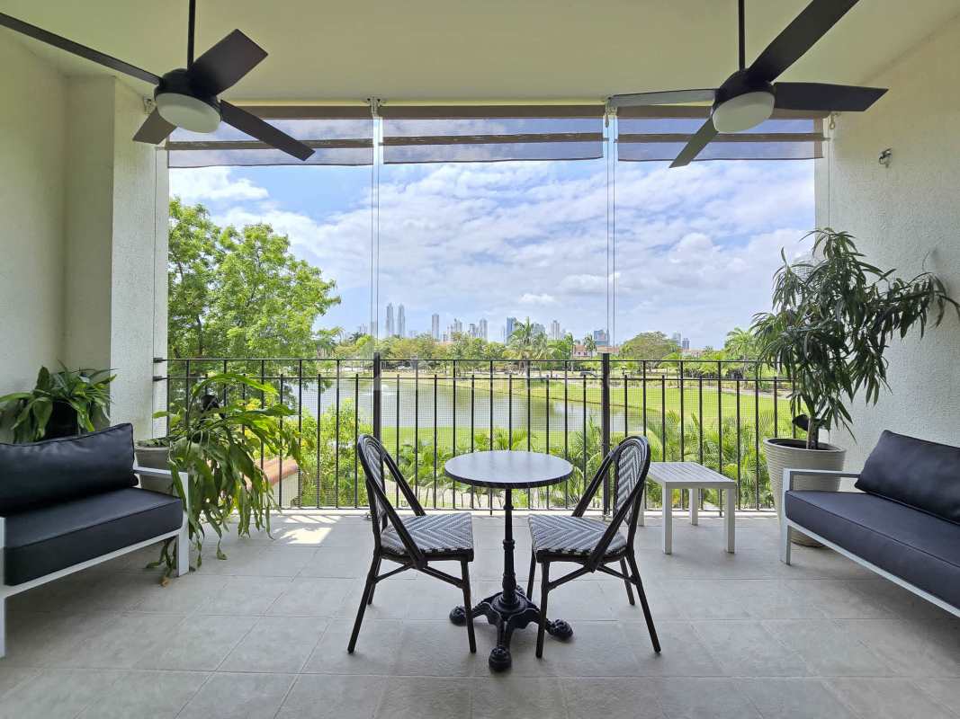 Bright living area with marble floors, large windows and terrace access overlooking golf course Santa Maria Panama