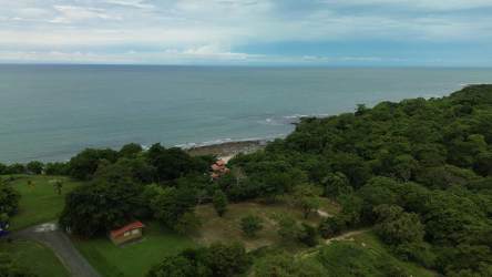 Bright living room with ceramic tiles and balcony door facing beach in Playa Corona apartment