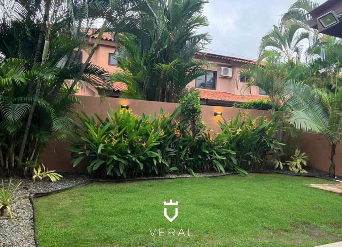 Private lush garden with palms at duplex house in Versalles Costa Sur Panama