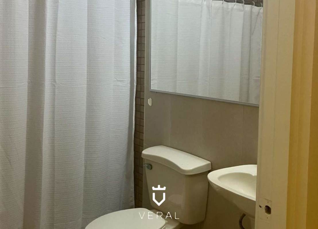 Bathroom with shower curtain, sink, basic fixtures at Versalles duplex home Panama