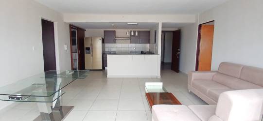 Modern kitchen with granite counters and dark cabinetry PH Midrise Panama Pacifico