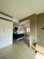 Bright spacious living room with large windows mountain view PH River Valley Panama Pacifico