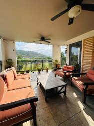 Open modern kitchen with island and dining area in PH River Valley Panama Pacifico