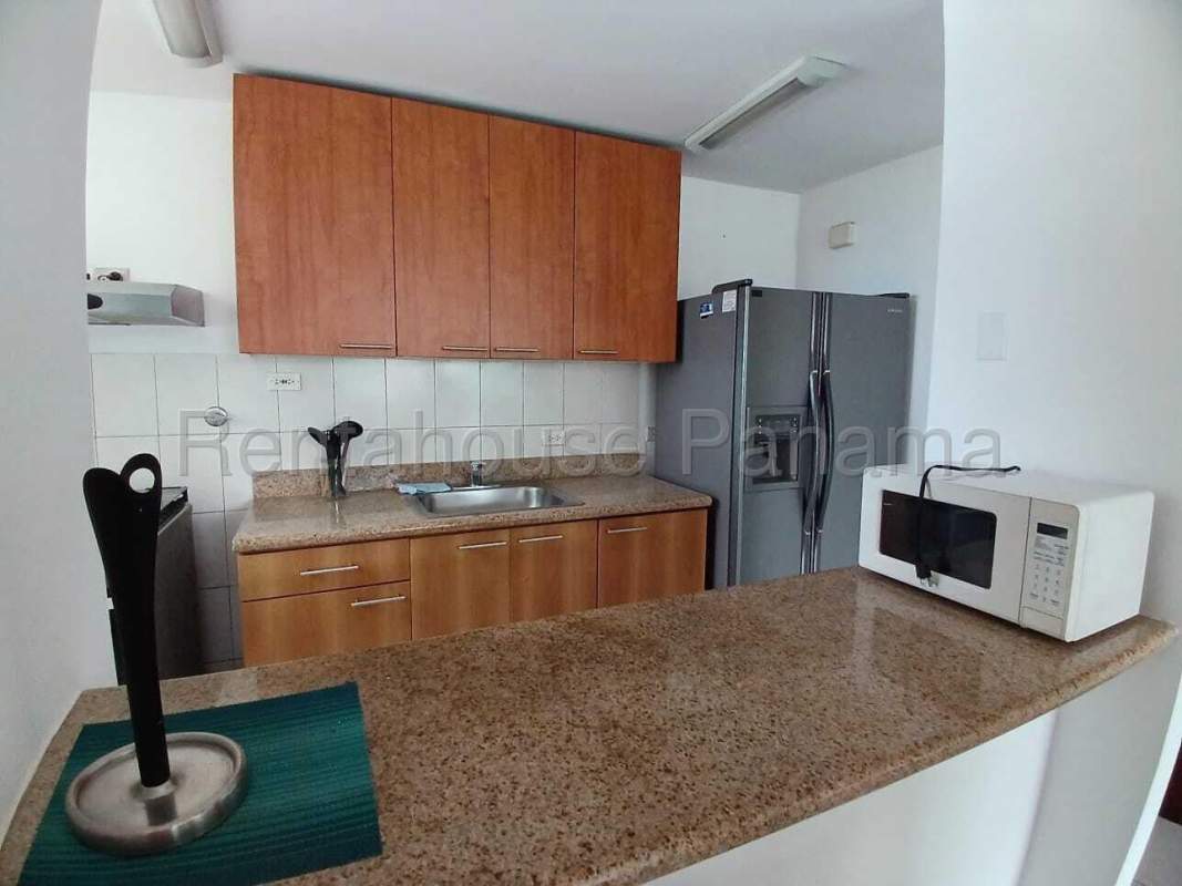 Spacious living room with glass sliding doors to balcony at PH Terramar Panama City