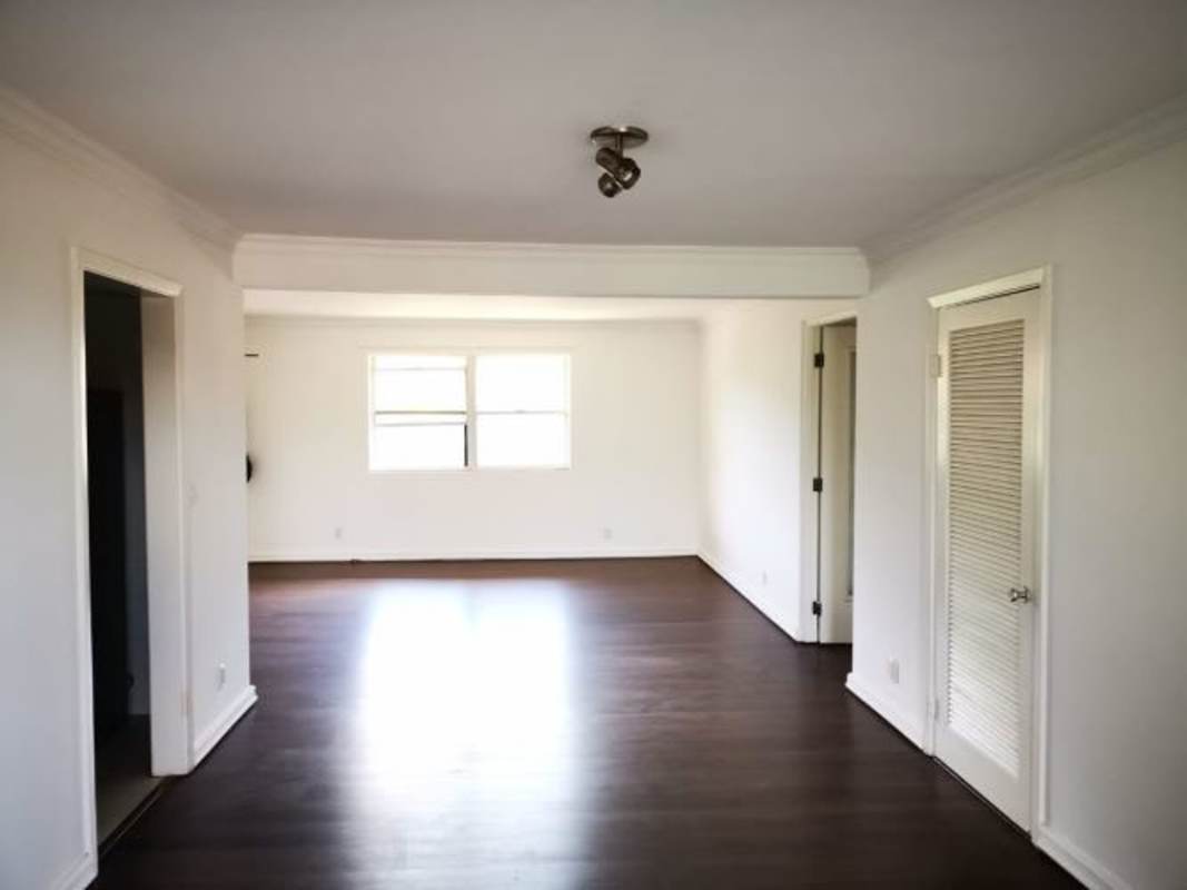 Modern loft space with spiral stairs, large windows, bright interior remodeled apartment in Clayton Panama