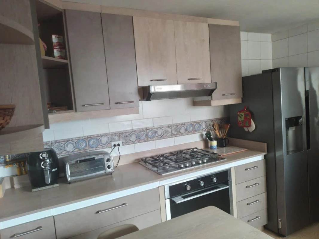 Dining area in PH Cariari with large windows and city views, El Carmen Panama City