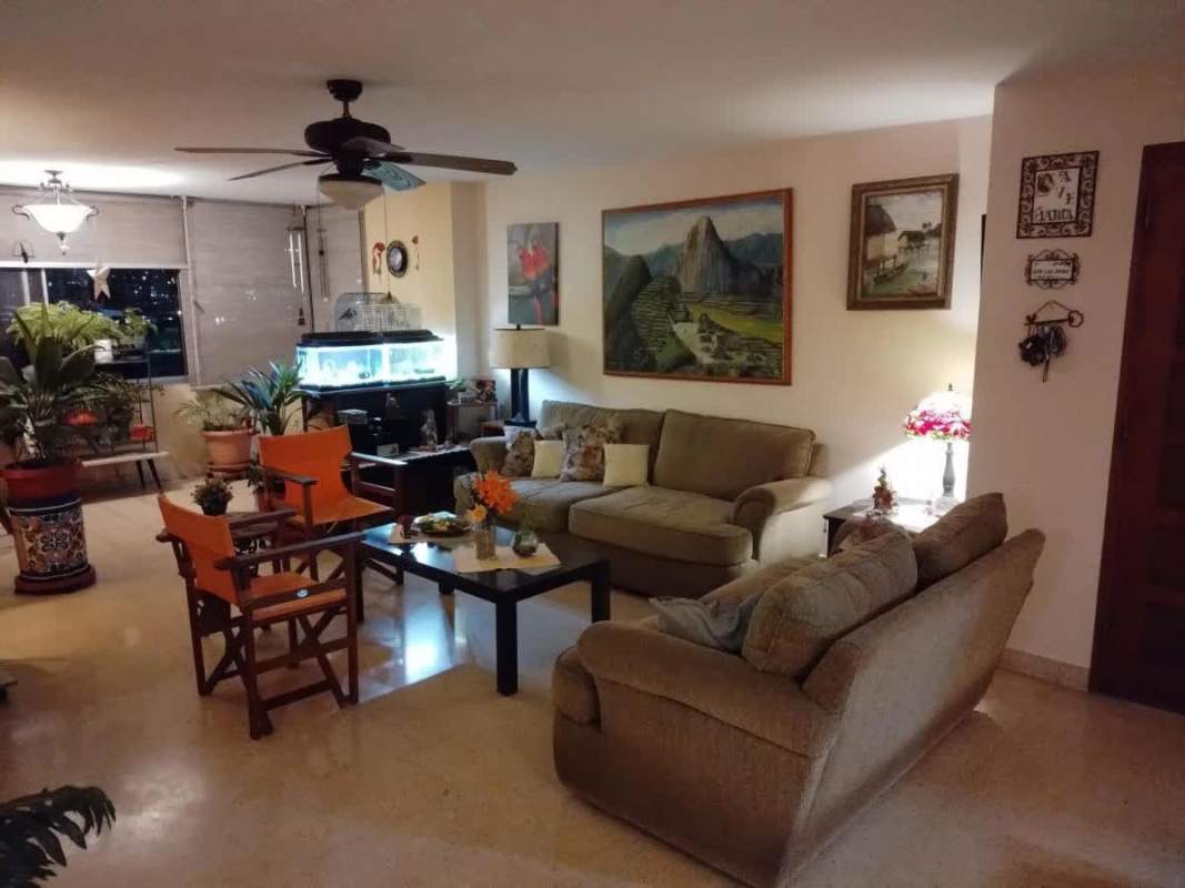 Functional kitchen with wood cabinetry, gas stove, appliances in PH Cariari El Carmen