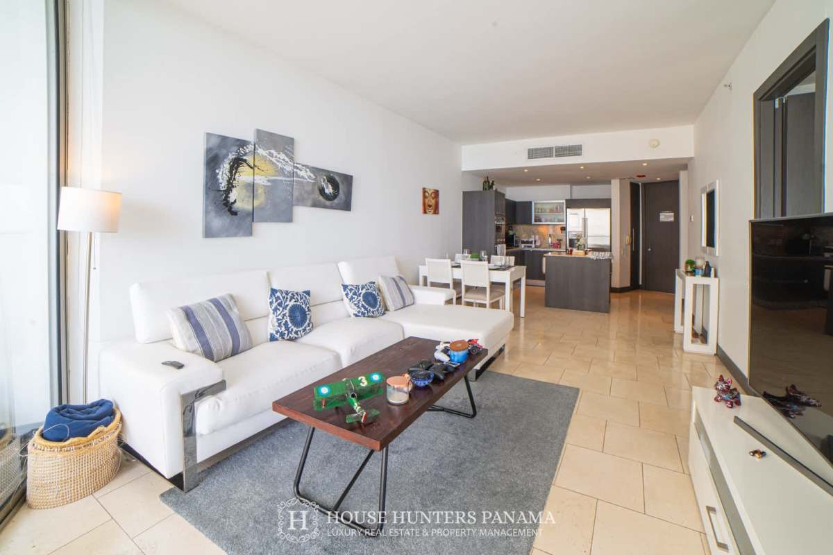 Master bedroom with ocean view windows and marble floors at The Ocean Club Punta Pacifica Panama