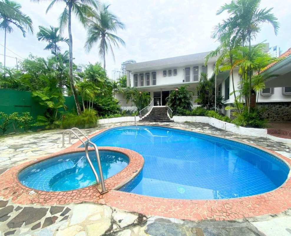 Luxury villa with large private pool and jacuzzi, surrounded by tropical garden at Altos del Golf Panama City