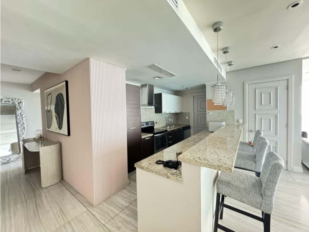 Fully equipped granite countertop kitchen with breakfast bar at PH Oceanaire Punta Pacifica Panama City