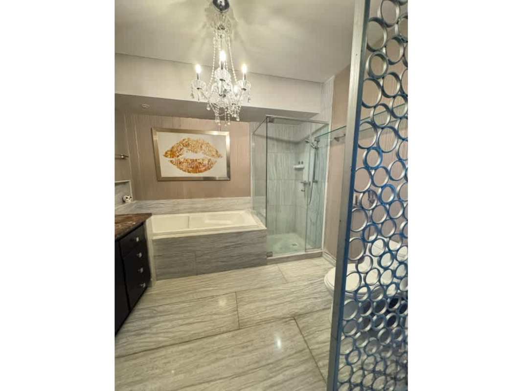 Contemporary bathroom with glass-enclosed shower and luxury fixtures PH Oceanaire Panama City
