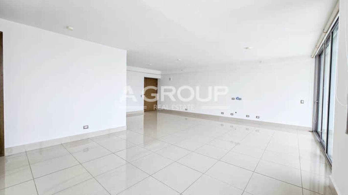 Bright spacious living dining room with large windows balcony access PH Bali Costa del Este Panama City
