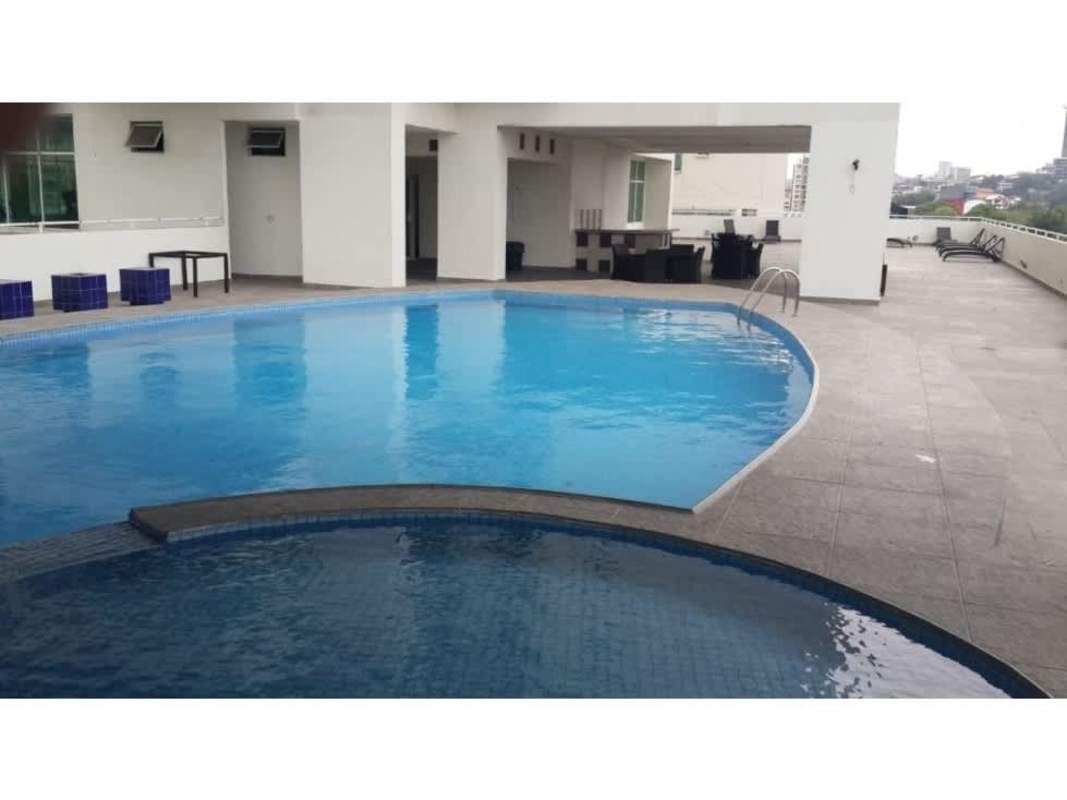 Modern swimming pool deck with city views at Vivendi Tower Edison Park Panama City