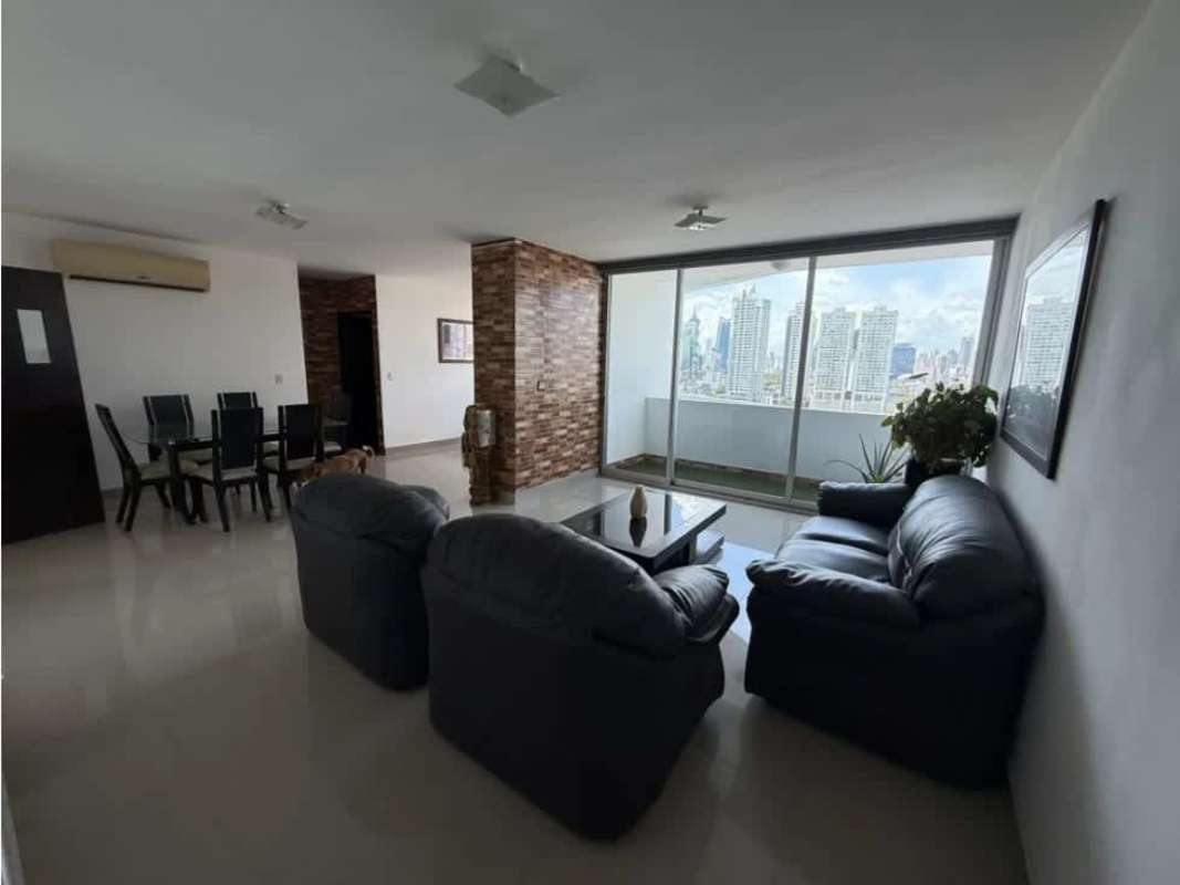 Spacious living and dining area open space with brick wall and city skyline view PH Infinity Tower Panama