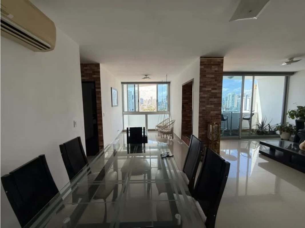 Furnished bedroom with large window and city skyline view at PH Infinity Tower San Francisco Panama