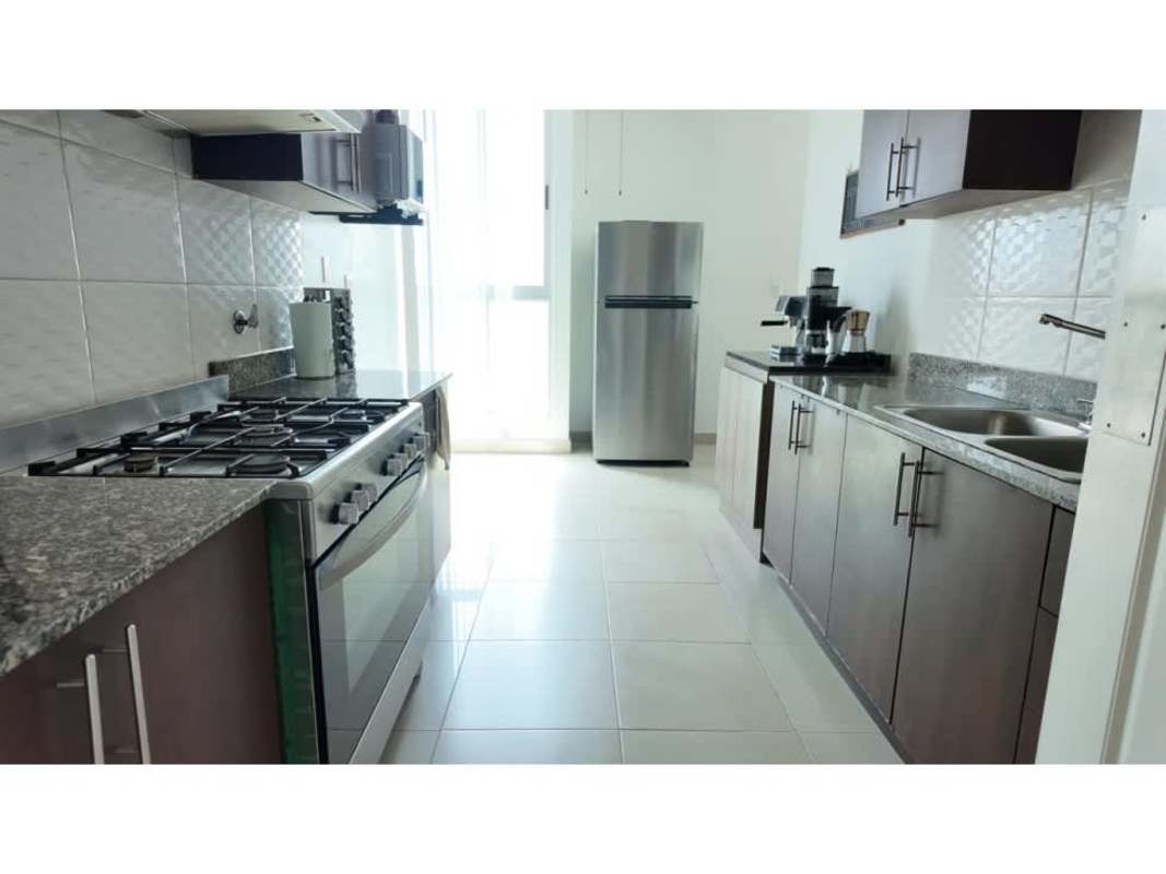 Kitchen with granite counters, stainless appliances at PH The Hill Tower Panama City