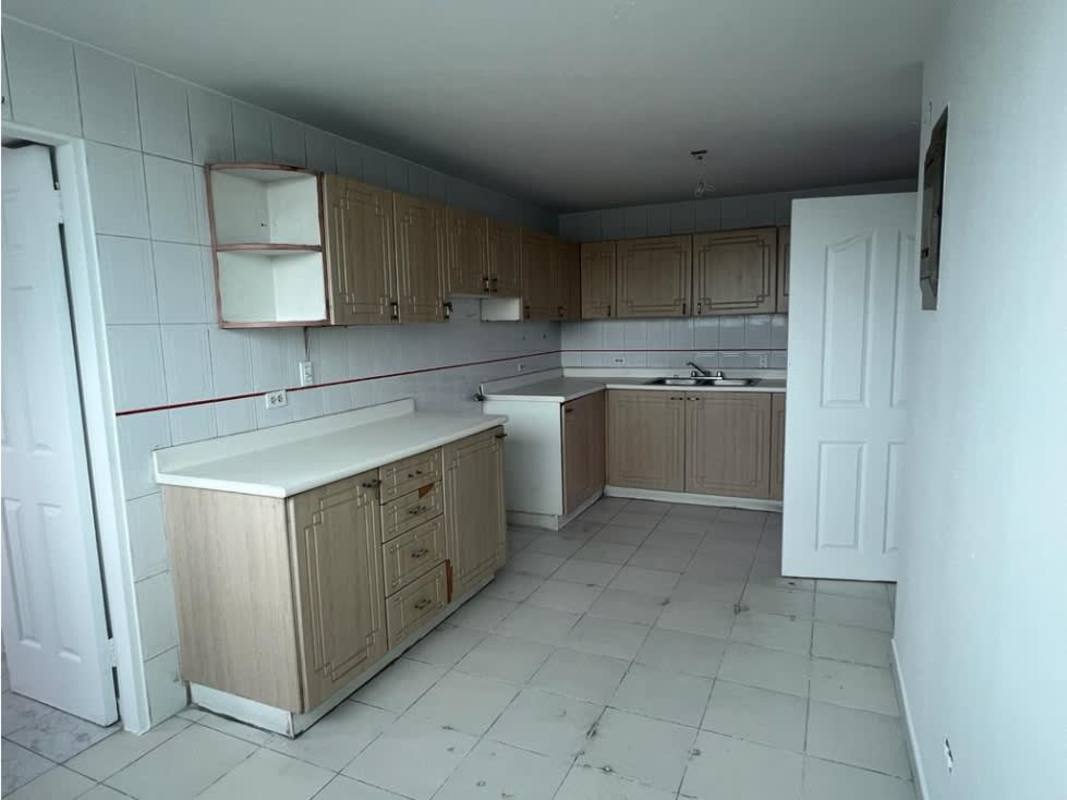 Spacious open living and dining area with tile floor and panoramic views at Torre Cosmo