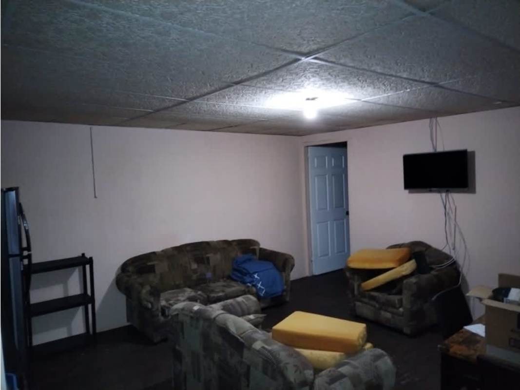 Simple living room with sofa set and TV setup in Altos de Las Acacias Juan Díaz Panama