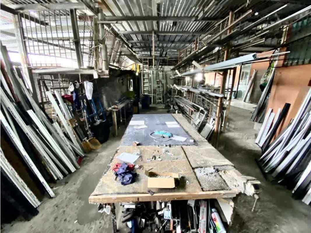 Industrial interior view with workbench and metal shelving warehouse for sale Tocumen Panama