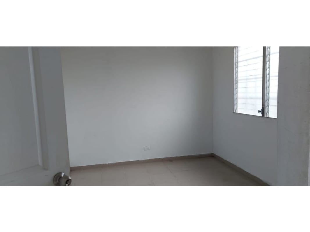 Spacious living dining area with windows bright ceramic tile floors in affordable house Praderas de San Lorenzo Panama