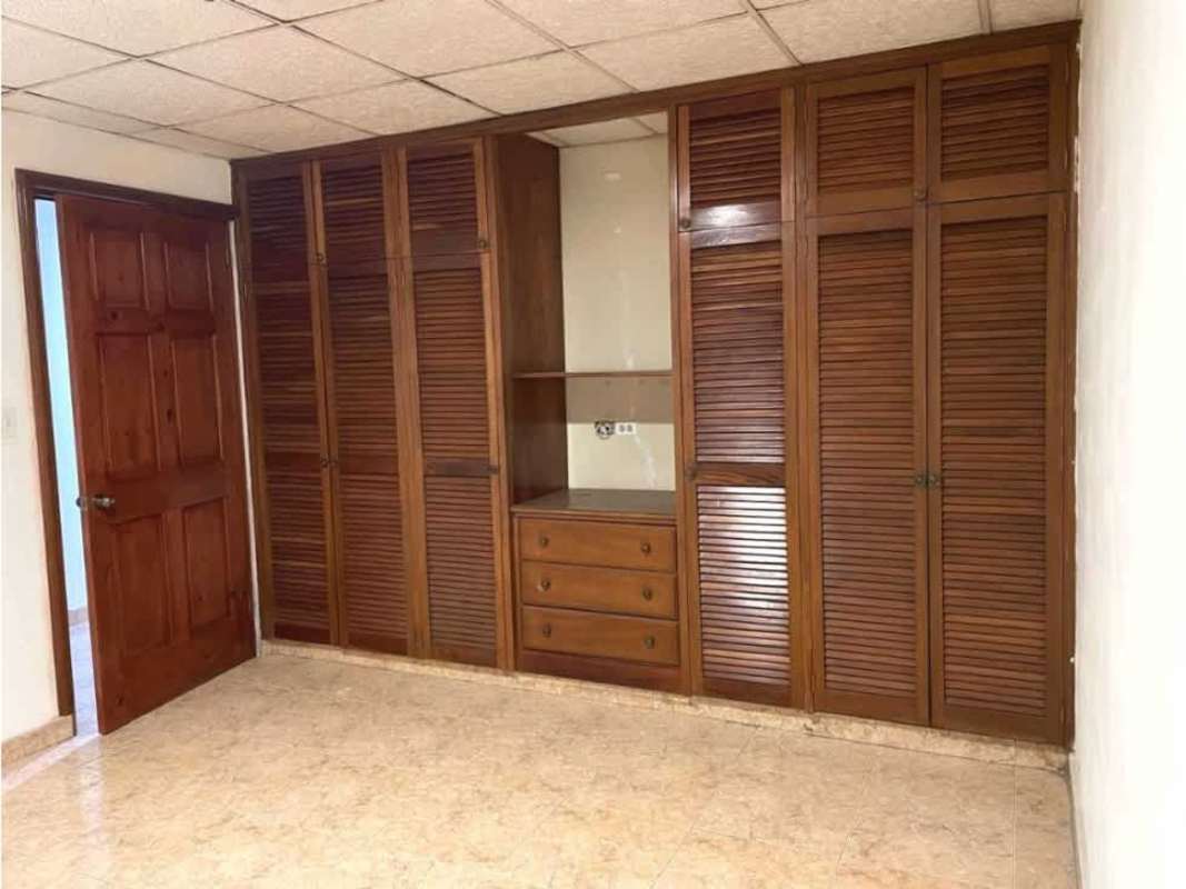Spacious bedroom with wood wardrobes, louvered closet doors at Hato Pintado Panama