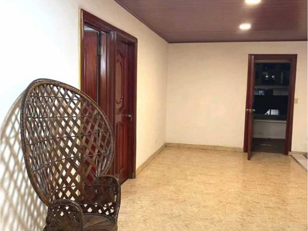 Interior hallway lined with wooden doors, recessed lighting in rental house Panama