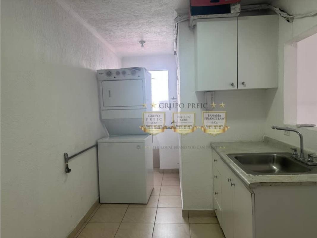 Empty living room with large windows, tile flooring, white walls, PH Parque Lindo Panama