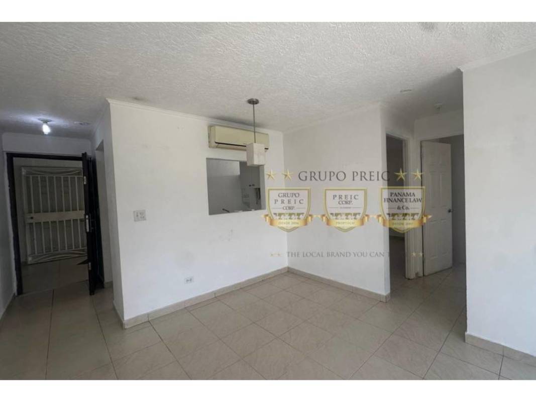 Modern living room with tiled floors and open kitchen window PH Parque Lindo Panama