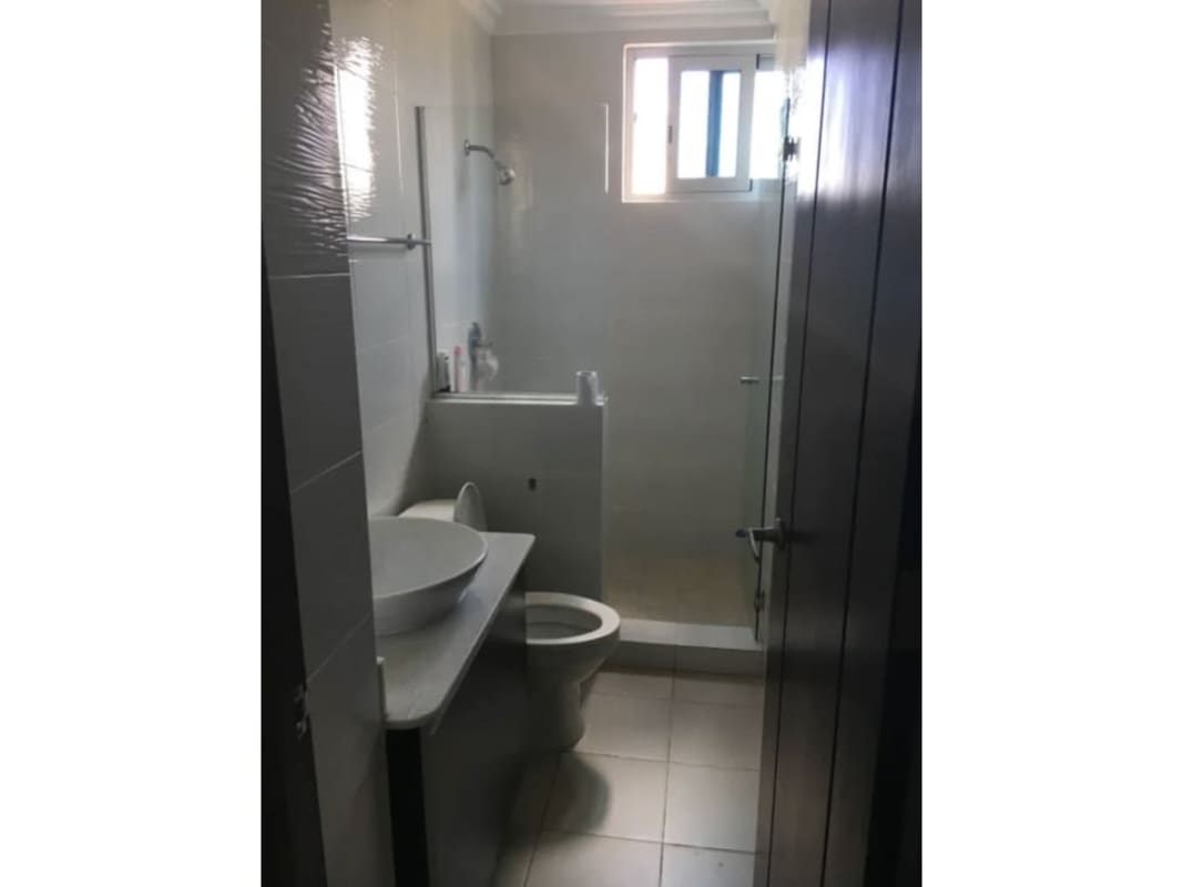 Contemporary kitchen with wood cabinets, granite counters, stainless appliances in PH Park City El Cangrejo