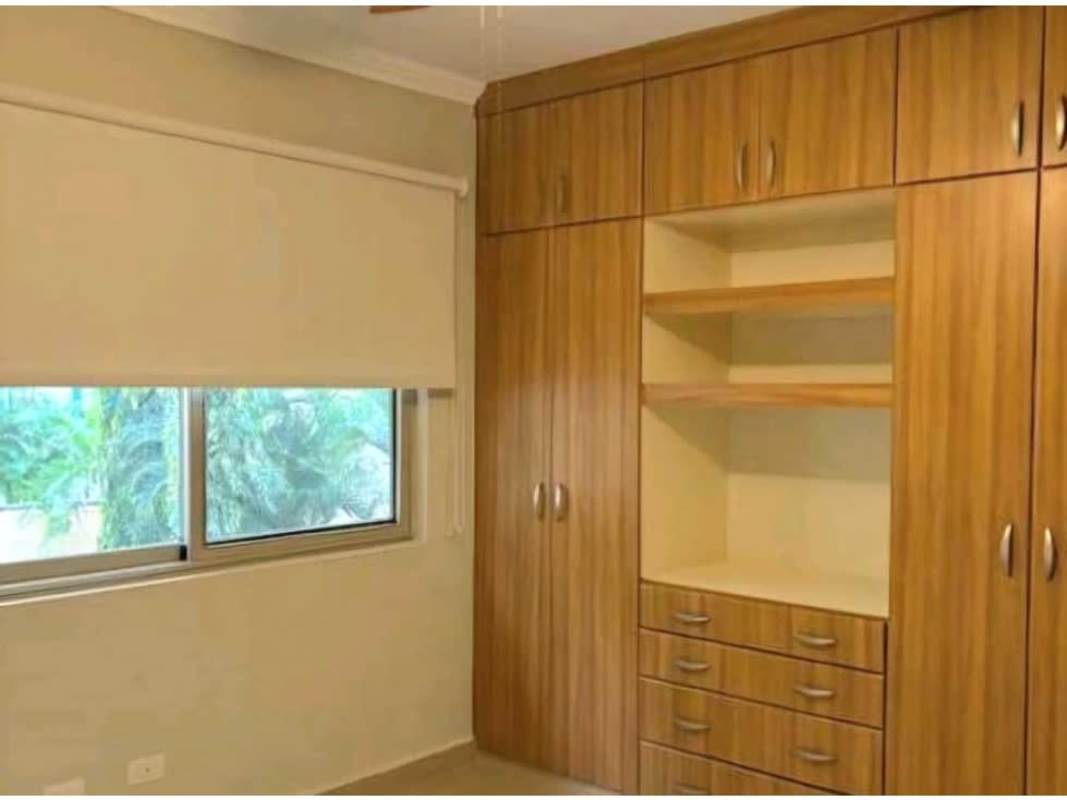 Bedroom with built-in wooden closet and garden view PH Embassy Gardens Clayton Panama