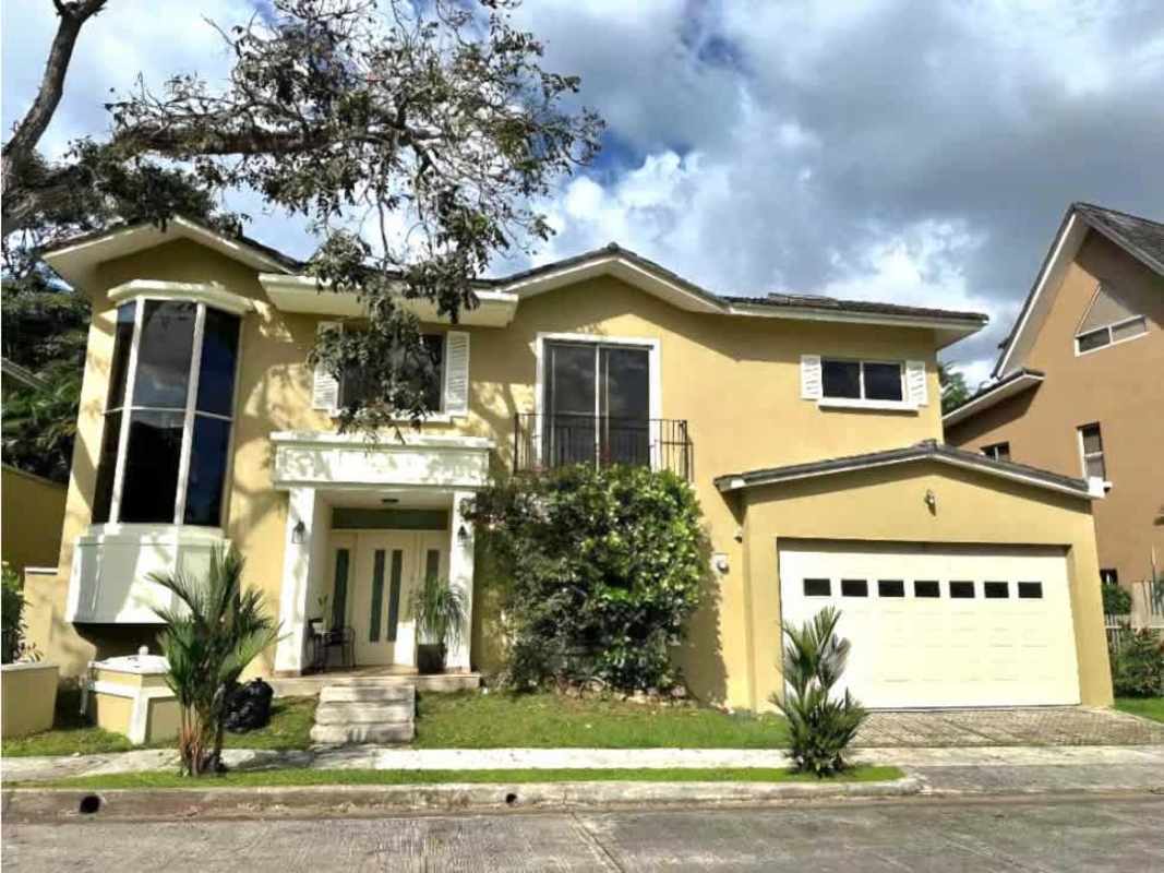 Spacious living area with tile floor, large windows, and ceiling fans in Embassy Gardens Clayton