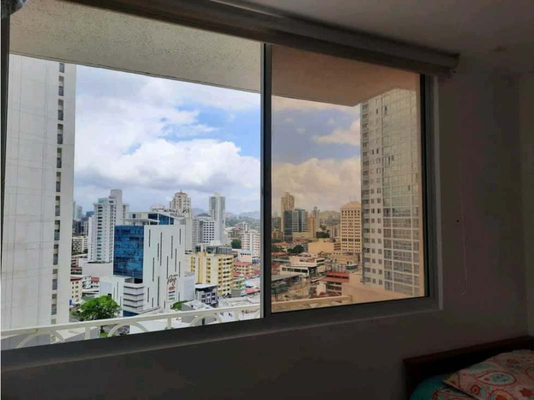 Bedroom interior with AC, tulip curtains, window with Panama City view PH Diana Tower