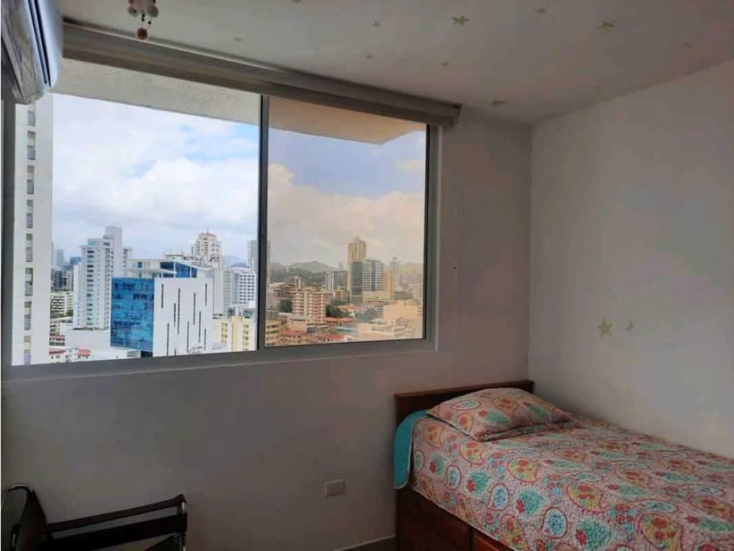Bedroom with large window and city skyline view PH Diana Tower Obarrio Panama City