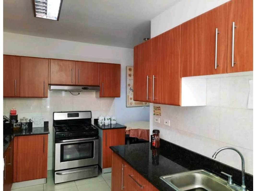 Bedroom with city skyline through large window, roller blinds, PH Diana Tower Obarrio