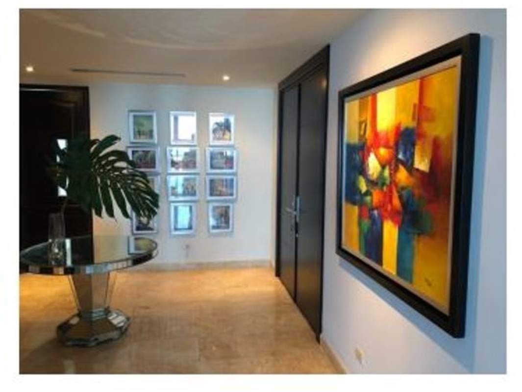 Luxury apartment entrance with modern decor, marble flooring at PH Torre Zeus Costa del Este Panama City