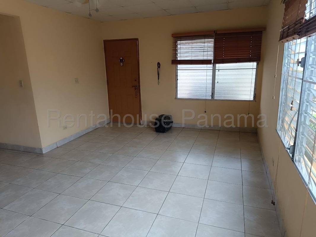 Functional kitchen with gas stove open shelving yellow walls Betania Panama