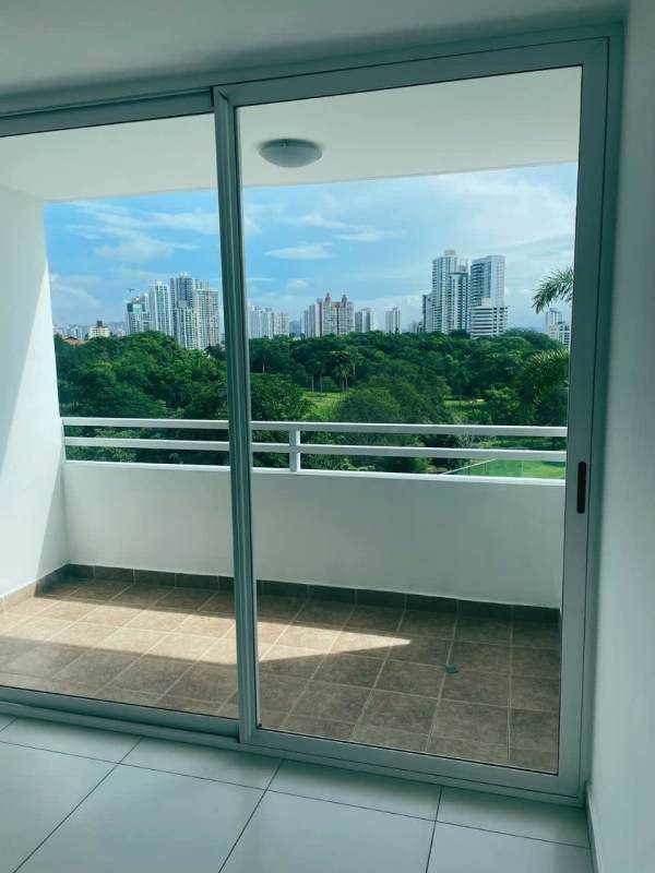 Living room with balcony access and large windows at PH Tee One Via Porras Panama