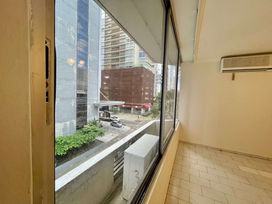 Enclosed balcony with large windows city views AC unit PH Ocean View San Francisco Panama