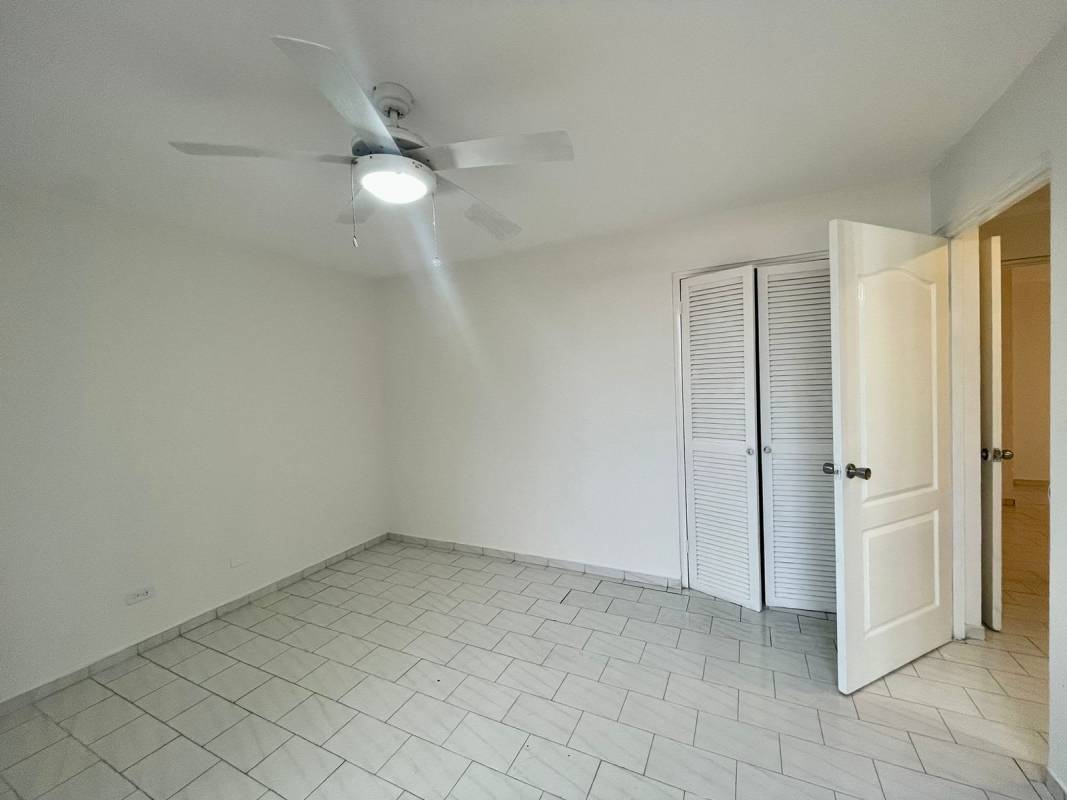 Living dining space with large windows tile floors ceiling fan PH Ocean View Panama