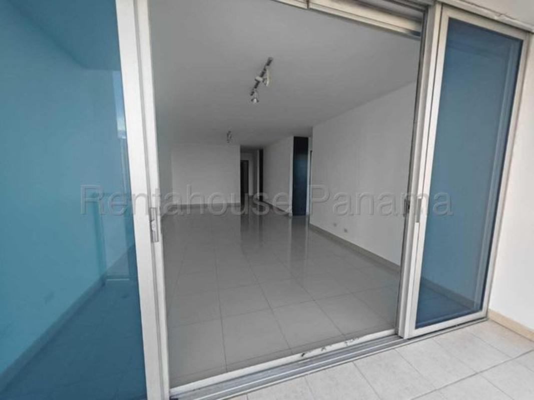 Bathroom with glass shower enclosure, granite countertop and mirror PH Serenity Panama City