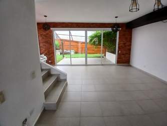 Kitchen with granite countertops, ceramic tile, built-in oven in Villas de Arraijan home Panama