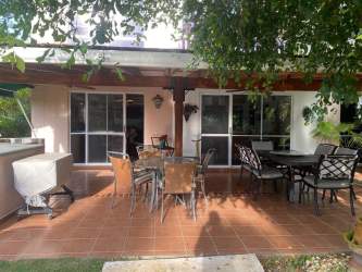 Gazebo-covered jacuzzi and private swimming pool surrounded by lush tropical garden Costa Blanca