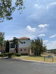 Bright bedroom featuring air conditioning, ceiling fan, and garden view in El Farallón Panama
