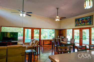 Covered parking area lush gardens mature trees country estate Boquete Panama