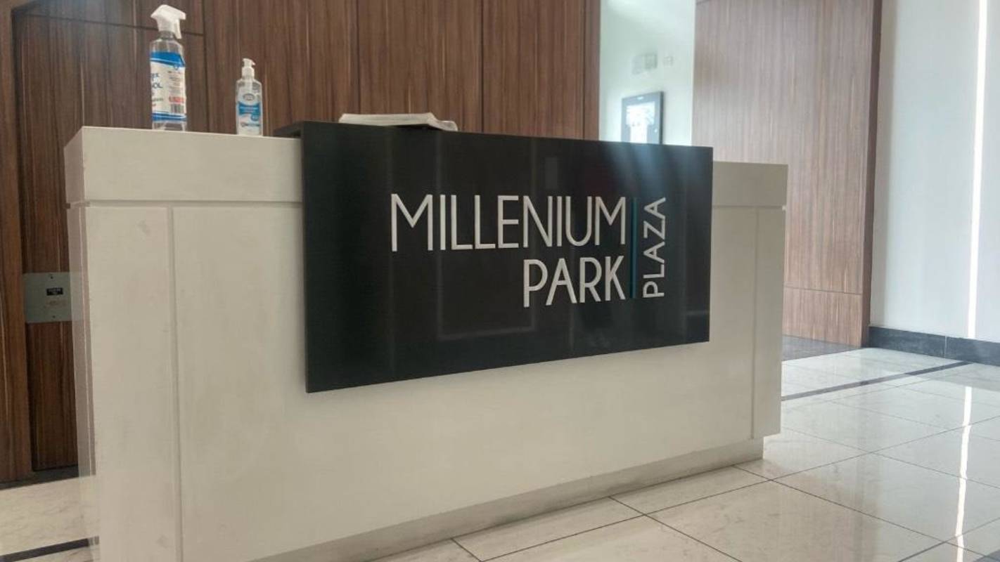 Reception desk at Millenium Park Plaza lobby with modern wall panels in Panama City Panama
